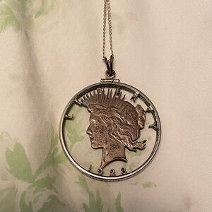 1923 silver dollar cut-out pendant